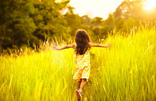 Child running in field - Mindful Healthy Life