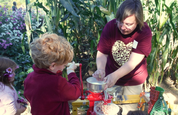 Arcadia Farm griding corn fall festival