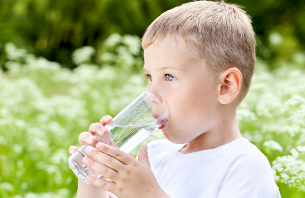 water - child drinking a glass