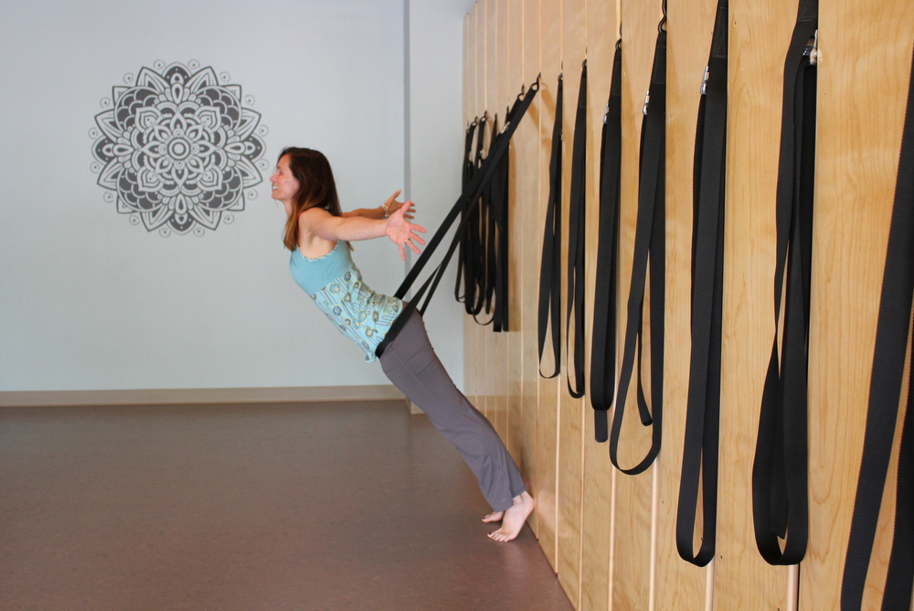 Ease Yoga Cafe by Mindful Healthy Life - owner Tara at wall