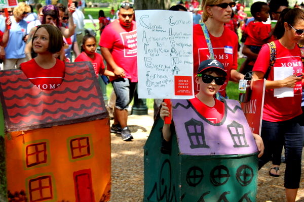 Moms Clean Air Force Play-In for Climate Action 2015 child marching with sign