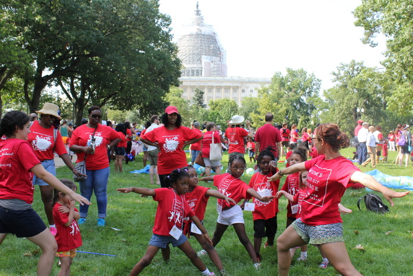 Moms Clean Air Force Play-In for Climate Action 2015 yoga Amanda Jones warrior pose