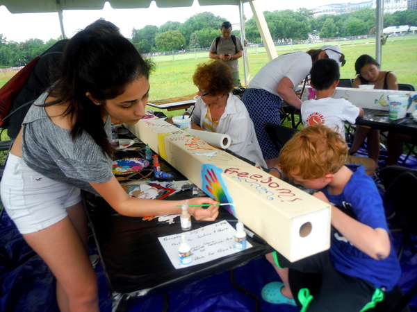 World Children's Festival 2015 - group working on peace pole  - by Mindful Healthy Life