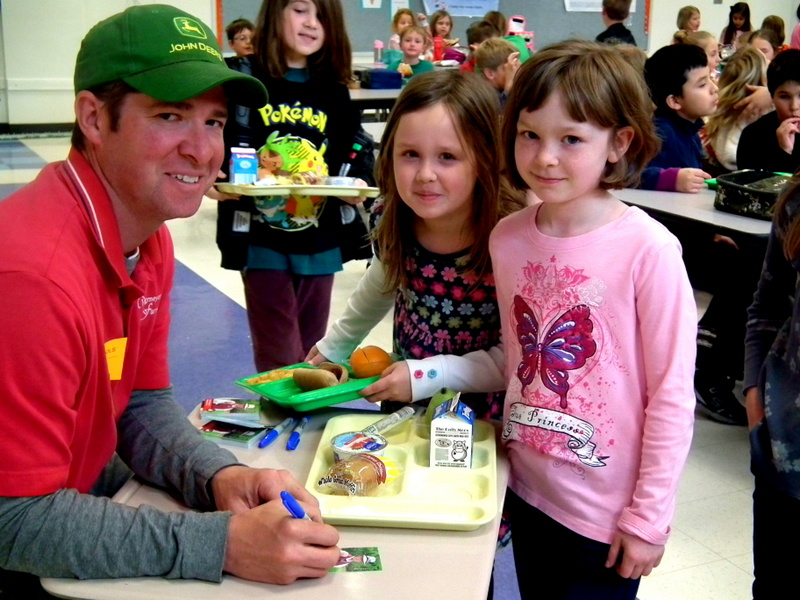 farmer signing Loudoun County trading cards