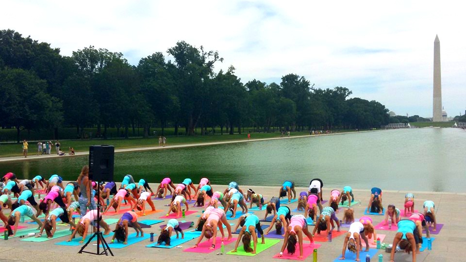 ivivva coasttocoast yoga on the Mall downward facing dog with washington monument